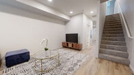 Located at 2902 Falk Rd in Vancouver, WA, this two-story home offers a well-designed layout across two evenly proportioned floors. The main level features an open-concept living room and kitchen area bathed in natural light from large windows with blinds. The living room showcases light wood-style luxury vinyl flooring, recessed lighting, and a clean, modern aesthetic. The kitchen is outfitted with stainless steel appliances — including a refrigerator, range, and over-the-range microwave — complemented by white shaker-style cabinetry and light countertops. A convenient half bathroom is also found on this floor. The staircase connects to the upper level, where both bedrooms are located. The bedrooms feature plush carpet flooring, ample natural light, and closets with built-in shelving. The primary bedroom offers a comfortable, cozy footprint. The three bathrooms are finished with wood-style flooring, white cabinetry, and clean fixtures, with at least one featuring a sliding-door glass shower enclosure. Throughout, the home maintains a neutral, contemporary palette with crisp white walls and consistent modern finishes that create a cohesive and inviting atmosphere.