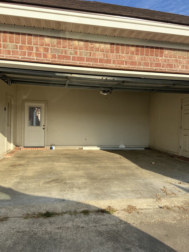 2 car garage with remote control and storage room. Accessible attic for storage - 308 Thatcher Ln