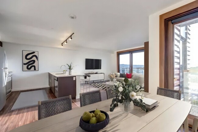 One room holds the cooking, the eating and the sitting, comfortably. - Ballard Lofts