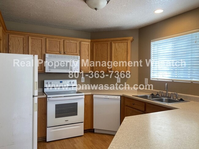 Building Photo - Check Out This Amazing 3 Bedroom 2 Bathroom Condo In Riverton! 50% Off First Month's Rent Move in...