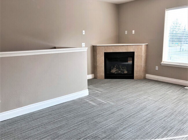 Living Area w/Gas Fireplace - 256 E 56th Ave