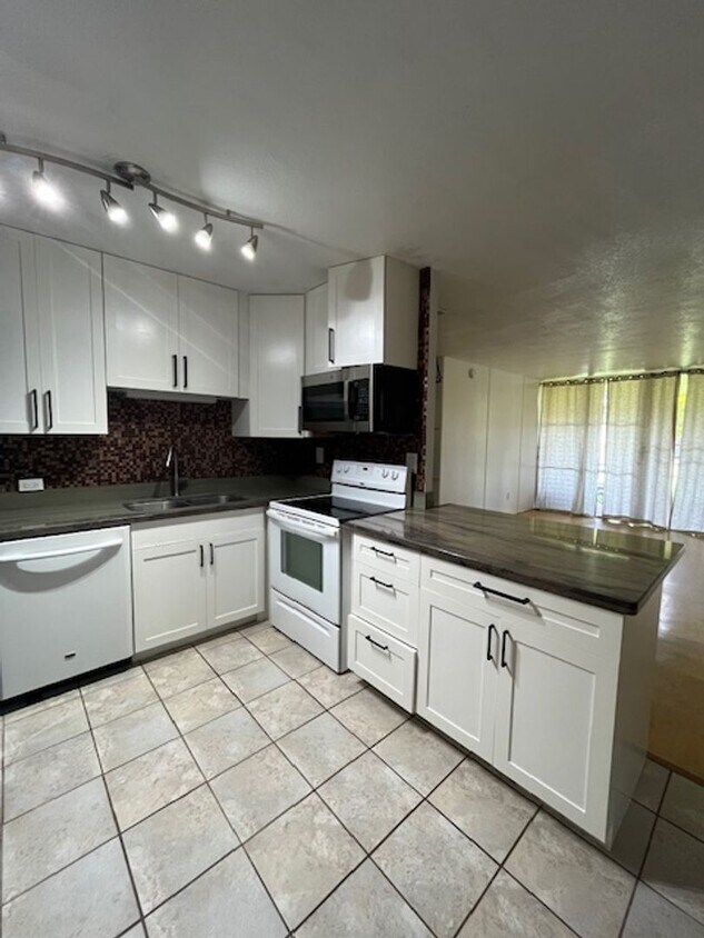 Primary Photo - 2 bedroom/1 bath Ground-level unit nestled...