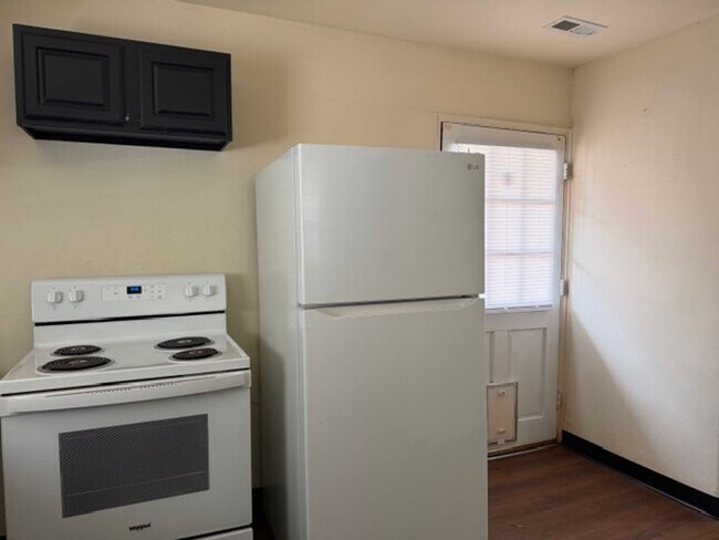 Building Photo - Tranquility inside. City adventures outside. Discover both in Downtown Cary!