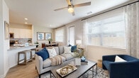 Located at 15255 FM 529 Rd in Houston, TX, this two-story home offers a thoughtfully designed layout with modern finishes and a warm, cohesive aesthetic. The main level showcases an open-concept living and dining area filled with natural light from multiple windows dressed in sheer curtains and blinds. The living room features light wood-look flooring, a ceiling fan, and comfortable, stylishly arranged seating. The adjacent dining area is anchored by a round marble-top table and complemented by framed blue abstract artwork. The kitchen is outfitted with crisp white cabinetry, granite countertops, a subway tile backsplash, and stainless steel appliances including a French door refrigerator and dishwasher. Upstairs, the bedrooms provide a calm retreat, each with plush carpeting, generous natural light, and tasteful neutral décor. The primary bedroom is spacious and serene, while additional bedrooms offer comfortable accommodations. Bathrooms throughout feature granite vanity tops, white cabinetry, wood-look flooring, and marble-style tiled tub surrounds. The overall design blends contemporary and transitional elements, creating a clean, inviting atmosphere that flows seamlessly from room to room.