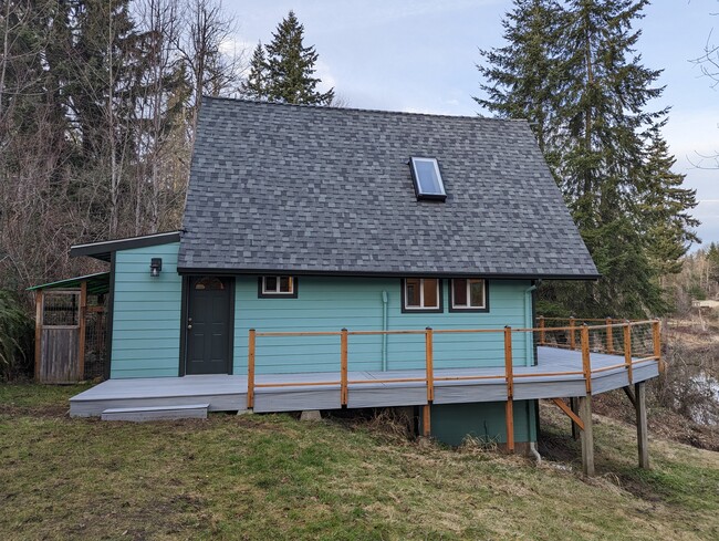 Front door and wrap-around deck - 23603 W Lake Kayak Dr