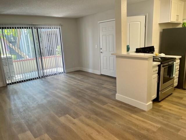 View of living area and kitchen - Independence Plaza Apartment Homes