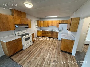 Building Photo - 1100 W 32nd Ave