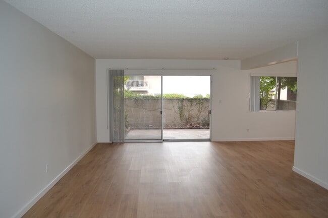 Living Room with Private Yard Outside - The Huntington Sunset