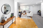 Located at 470 Scenic Dr in London, Ontario, this thoughtfully designed one-bedroom, one-bathroom unit offers a clean, modern aesthetic across a single floor. The open-concept living and kitchen area forms the heart of the unit, where light laminate flooring, recessed lighting, and large windows with lush tree views create a bright and welcoming atmosphere. The kitchen is well-equipped with crisp white shaker cabinetry extending to the ceiling, stone-look countertops, stainless steel appliances including a full-size refrigerator, electric range, built-in microwave, and dishwasher — all finished with a contemporary flair. The living area features classic parquet hardwood flooring, a neutral colour palette, and generous natural light from windows overlooking greenery, providing a comfortable and versatile space. The bedroom is a calm retreat with parquet floors, a window framing tree canopy views, a double closet for storage, and soft, neutral tones throughout. The bathroom is neatly finished with a white vanity, granite-style countertop, a combined tub and shower, and coordinating light wood-tone flooring. Overall, the unit presents a cohesive, modern interior with practical finishes in a scenic setting.