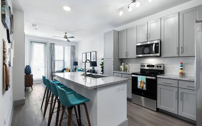 Modern Kitchen with Stainless Steel Appliances and Granite Countertops - Rhythm