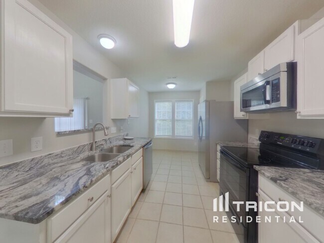 Foto del edificio - 9312 Tiger Lily Ln