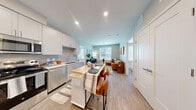 Located at 1639 E Tropicana Ave in Las Vegas, NV, this well-designed 2-bedroom, 2-bathroom unit offers a smart, efficient layout across a single floor. The open-concept living area seamlessly connects the kitchen, dining, and living spaces, all finished with light wood-style flooring that runs throughout. The contemporary kitchen is equipped with stainless steel appliances — including a French door refrigerator, range, microwave, and dishwasher — complemented by crisp white shaker cabinetry, a gray subway tile backsplash, and a movable island with butcher block top that doubles as a dining bar. Recessed lighting keeps the space bright and functional. Both bedrooms are comfortably sized, featuring ceiling fans, large windows with natural light, and dedicated closets. The primary bedroom offers a cozy, quiet retreat, while the second bedroom also benefits from generous window placement. The two bathrooms are cleanly appointed — one with a full soaking tub and shower combination, and the other with a vanity and toilet. Additional highlights include in-unit laundry and a layout that makes efficient use of every square foot, offering a practical and modern living environment in a convenient Las Vegas location.