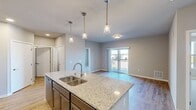 Step into a world of refined living in this exquisite Waunakee gem. The heart of the home beats in the gourmet kitchen, where sleek stainless steel appliances and gleaming granite countertops inspire culinary creativity. Bask in the warmth of natural light flooding through large windows, illuminating plush carpeted bedrooms that promise restful nights. Luxuriate in spa-like bathrooms featuring elegant vanities and ample storage. The open-concept design creates a seamless flow, perfect for entertaining or quiet evenings at home. With its blend of style and functionality, this home isn't just a place to live—it's a canvas for the life you've always imagined. Your journey to inspired living starts here.