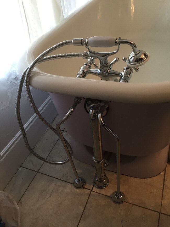 Antique skirted tub - 58 Mc Master Street