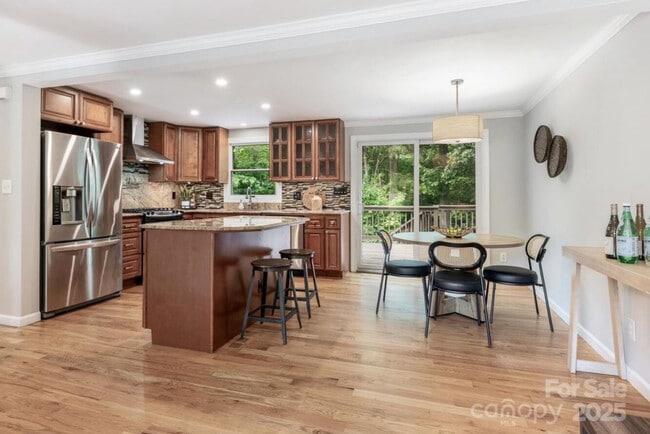 Kitchen overlooks the woods - 9324 Rainbow Forest Dr