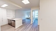 This contemporary 1-bedroom, 1-bathroom apartment at 10 Hanover Square in Manhattan offers 690 square feet of thoughtfully designed living space. The open-concept layout maximizes functionality, seamlessly blending the living and dining areas with the kitchen. The spacious primary bedroom, measuring 180 square feet, provides a comfortable retreat.

The kitchen is a highlight, featuring crisp white cabinetry, stainless steel appliances, and a practical island that doubles as a breakfast bar. The bathroom showcases modern fixtures and neutral-toned tilework, creating a spa-like atmosphere.

Throughout the apartment, large windows allow abundant natural light to flood the space, enhancing the airy feel. The use of light-colored walls and ceilings further amplifies the sense of spaciousness. Durable wood-look flooring unifies the entire apartment, adding warmth and elegance.

Climate control is ensured through strategically placed HVAC units, while roller blinds offer privacy when needed. The thoughtful design includes a closet for storage, contributing to the apartment's overall functionality.

This well-appointed home in a prime Manhattan location combines style and practicality, making it an ideal urban dwelling for those seeking a modern lifestyle in the heart of New York City.