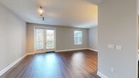 Located on Franklin Avenue in the heart of Los Angeles, CA 90028, this one-bedroom, one-bathroom unit offers a well-designed single-level layout with a comfortable and functional flow throughout. Rich hardwood-style flooring extends across the living spaces, lending warmth and continuity to every room.

The living room is generously proportioned, featuring track lighting, French doors, and multiple windows fitted with blinds that invite natural light while maintaining privacy. A fireplace adds a classic architectural touch to the space. The open layout connects seamlessly to the kitchen and hallway, creating an efficient and easy-to-navigate floor plan.

The kitchen is equipped with warm-toned wood cabinetry, stainless steel appliances including a gas range, microwave, and refrigerator, complemented by light countertops and a decorative tile backsplash.

The bedroom is a comfortable retreat, featuring a ceiling fan with light fixture, a large window with outdoor views, and direct access to a spacious walk-in closet outfitted with dual hanging rods and built-in shelving for ample storage.

The bathroom includes a wood-toned vanity with a stone-finish countertop, a wall-mounted mirror, light tile flooring, and a grab bar for added accessibility. A dedicated entrance and hallway complete the layout, offering a practical and welcoming transition into the home.