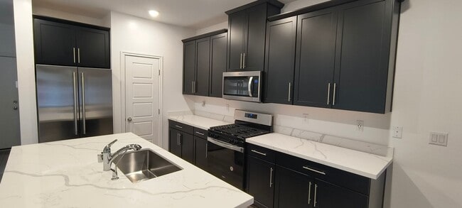 Building Photo - West Summerlin Townhouse - 1833-SqFt. - 3-beds, 2.5-baths, 2-car attached garage, Gated Comm.