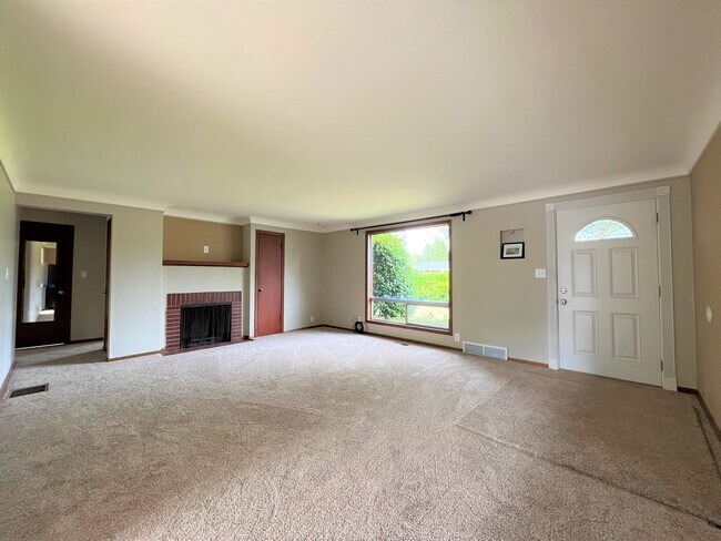 Spacious living room with fireplace - 11252 12th Ave SW
