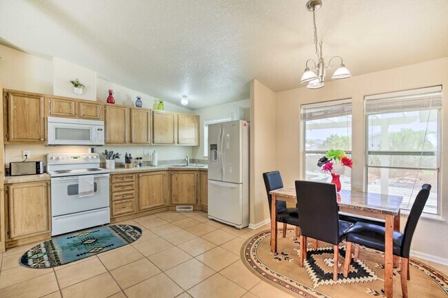 There are two fridges, another in - 10157 S Tornado Ave