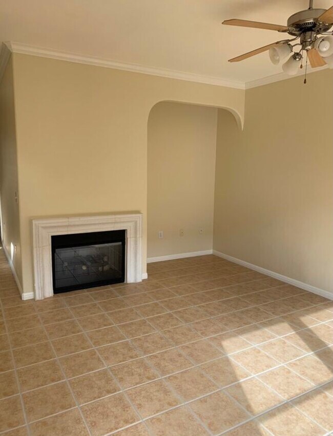 Living room with fireplace. Lots of natural light from windows looking out over backyard. - 7708 San Felipe Blvd