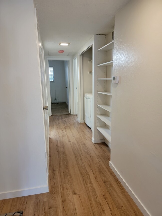 hallway with in unit high efficient washer/dryer - 1550 Newborough Dr