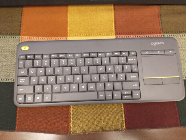 Remote keyboard and trackpad for working on big screen from the sofa. - 1830 Bryant St NE