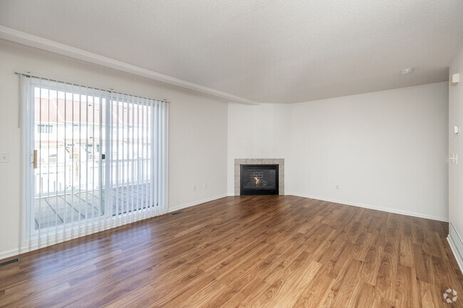 3BR, 2.5BA - 1,660SF - Living Room - The Brittany's Apartments and Townhomes