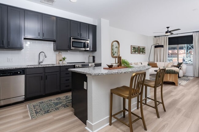 Kitchen island and breakfast bars available in select floor plans - The Battery on Blake Street