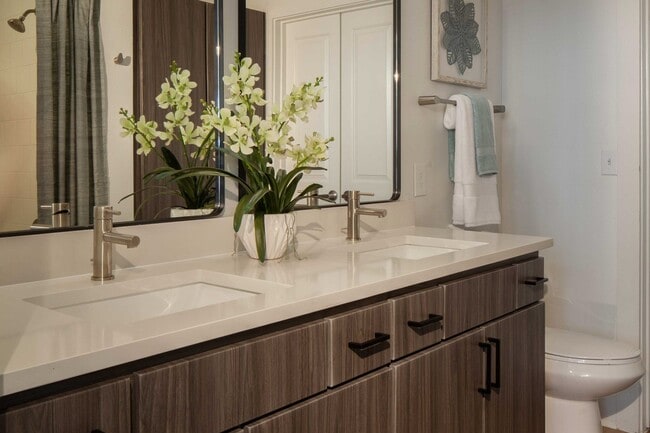 Remodeled bathrooms with luxury vinyl plank flooring - 2125 Yale Apartments