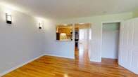 Located at 4633 Kirchoff Rd in Rolling Meadows, Illinois, this single-floor space offers a well-organized layout with warm hardwood flooring throughout the main living areas. The open living space is bright and inviting, accented by wall sconce lighting and a seamless connection to the kitchen via a pass-through opening with a light stone countertop ledge — ideal for casual dining or entertaining. The kitchen is efficiently designed in a galley style, featuring warm oak cabinetry, light granite-style countertops, a tile mosaic backsplash, stainless steel appliances including a refrigerator and microwave, and a double stainless steel sink. Bedrooms are generously sized with large windows dressed in vertical blinds that invite natural light and offer outdoor views. Baseboard heating runs along the walls, and window-unit air conditioning is present in one of the bedrooms, ensuring year-round comfort. A closet with sliding doors provides ample storage. The bathroom is clean and modern, featuring a updated vanity with a white countertop, a framed mirror, a bright overhead light bar, and neutral tile flooring. Overall, the space presents a functional and comfortable layout with updated finishes throughout.