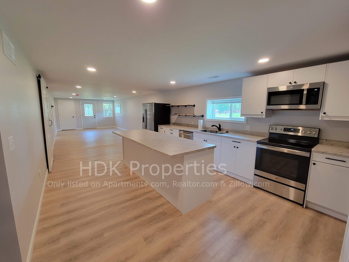 Kitchen facing living room and front door - 1566 Sugar Grove Rd