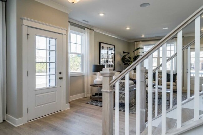 Building Photo - 3 Bedroom 2.5 Bathroom End Unit Townhome w/ 1st Floor Owners Suite and a 2 car Garage in the hear...