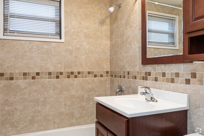 Baño - Englewood Village, LLC