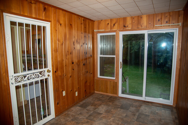 Mudroom attaches house to garage and provides access to the backyard. - 1911 Talmage Ave SE