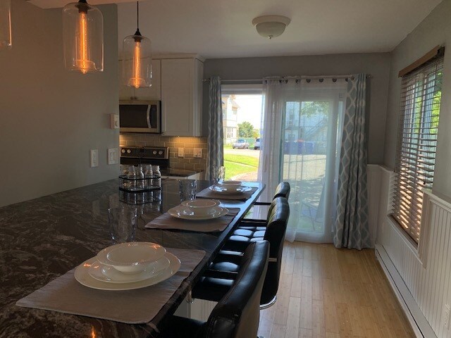 Versatile granite bar connects LR and Kitchen (3 bar stools included). - 31 Betts Plz