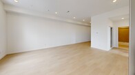 Located at 3211 Cedar St in Philadelphia, PA, this thoughtfully designed two-bedroom, one-bathroom unit offers a clean, contemporary aesthetic throughout. Light-toned hardwood flooring extends across the entire living space, complementing the bright white walls and recessed lighting that give every room an open, airy feel.

The open-concept kitchen serves as the heart of the home, featuring crisp white shaker cabinetry, a striking quartz island with an undermount sink and matte black faucet, and stainless steel appliances including a gas range, microwave, and full-size refrigerator. Pendant lighting with matte black fixtures adds a modern, sophisticated touch above the island.

The spacious living area benefits from recessed ceiling lights and a clean, minimalist design, offering a versatile canvas for any layout. Both bedrooms are well-proportioned, with the primary bedroom providing a generous amount of space. Each bedroom features large black-framed windows that frame elevated views of the Philadelphia skyline and surrounding neighborhood, flooding the rooms with natural light.

The bathroom is finished with neutral tile surrounding a full soaking tub and shower combo, accented by matte black fixtures that tie seamlessly into the home's modern design language. Clean lines and a cohesive neutral palette make this unit a refined urban retreat.