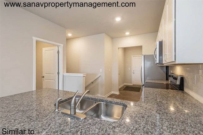 Building Photo - "Charming 2-Bedroom Home in Exclusive 36 W...