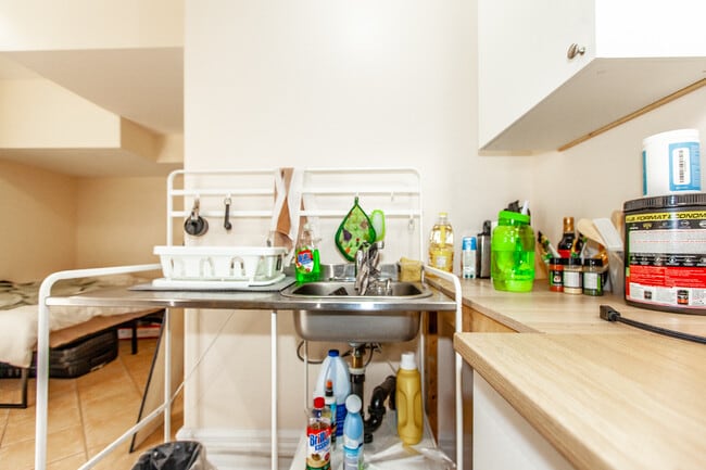 Building Photo - Bright, Beatutiful & Look Out Basement Apt.