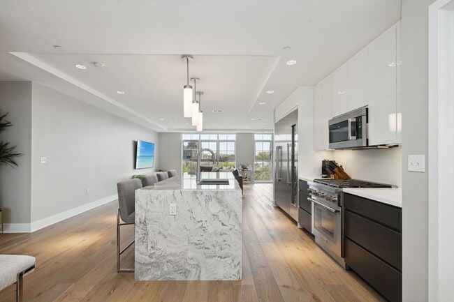 Photo - Elegant 2BR at The Adora | 1,500+ SF, Chef’s Kitchen & Garage Parking! House