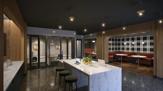Coworking space with private workstations, comfortable seating areas, and complimentary high-speed Wi-Fi. - Modera SoBro