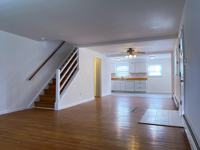 1st floor living area featuring new floor in the kitchen area; Brand new fridge will be added - 7243 Valley Ave