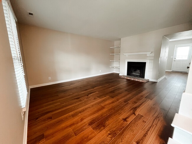 Living Room w/ built-in shelves and fireplace - 5750 Brentwood Trace