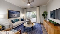 Located in Goodyear, AZ, this well-appointed two-bedroom, two-bathroom residence offers a thoughtfully designed single-story layout that balances style and functionality. Wood-look flooring flows throughout the main living areas, complemented by neutral gray tones and crown molding that lend a polished, cohesive feel.

The entrance opens into a welcoming hallway that leads to the open-concept kitchen and living room. The kitchen features dark, contemporary cabinetry with sleek hardware, white countertops, and stainless steel appliances, including a dishwasher. The living room is bathed in natural light from large sliding glass doors that open to a private patio with outdoor views, and a ceiling fan adds both comfort and character to the space.

The primary bedroom is a comfortable retreat, complete with a ceiling fan, a window with outdoor views, and a dedicated walk-in closet outfitted with wire shelving. The second bedroom offers generous space with wood-look flooring. Both bathrooms are finished with dark vanity cabinetry, white countertops, and wood-look tile flooring; one features a tub-shower combination. A hallway connects all rooms efficiently, and a dedicated closet provides additional storage throughout this well-designed home.