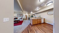 Located at 1201 E Helena Ave in Ellensburg, WA, this single-story, 3-bedroom, 2-bathroom home offers a thoughtfully designed layout that maximizes comfort and functionality. The open-concept main living area seamlessly connects the kitchen, dining room, and living room, creating an inviting, spacious atmosphere. The kitchen features warm honey-toned cabinetry, a tile backsplash, wood-look flooring, and full appliances including a refrigerator, range, and dishwasher. The adjacent dining area provides a defined space for meals, while the living room offers plush carpeting, a front entry door, and large windows that bring in natural light and outdoor views. Each of the three bedrooms is carpeted and includes closet space, with the secondary bedrooms featuring windows overlooking the surrounding landscape. The two bathrooms are finished with tile flooring, wood vanities, and well-lit mirrors. A dedicated in-unit laundry room with a full-size washer and dryer adds everyday convenience. Neutral tones and warm wood accents throughout create a cohesive, welcoming ambiance across the entire home.