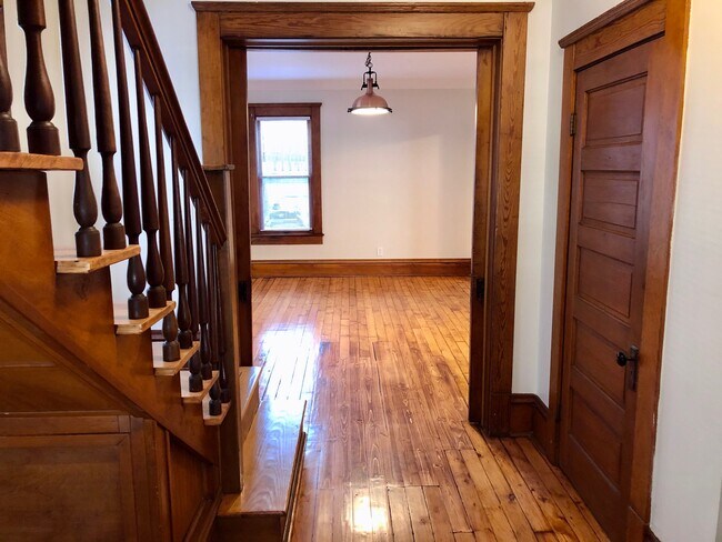 Front door hallway looking into living room - 1870 W 47th St