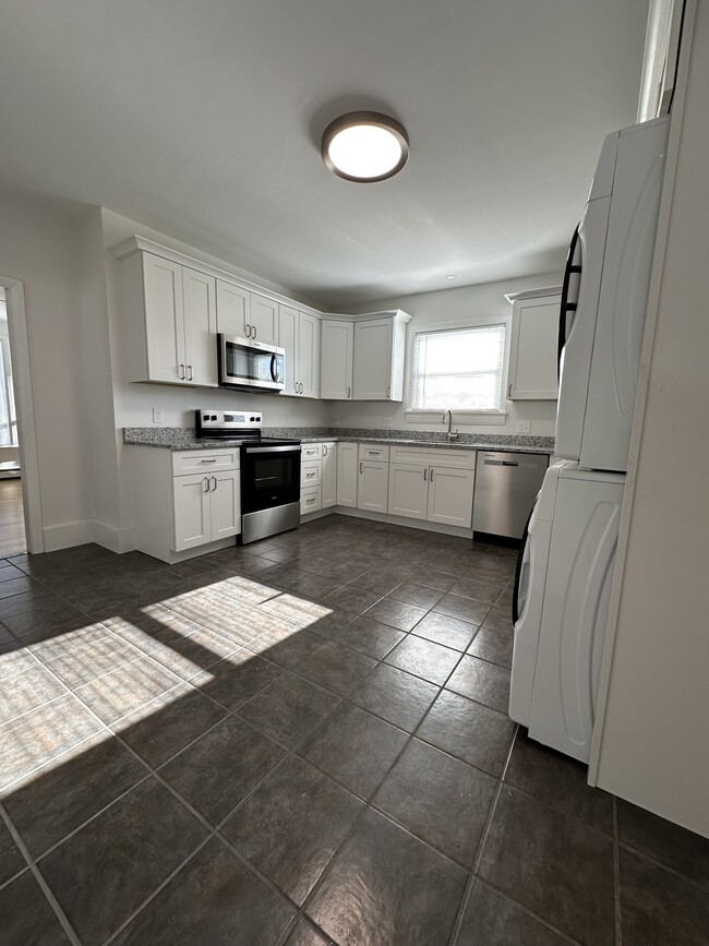 Fully renovated kitchen with brand, new microwave, stove, dishwasher, Refrigerator, washer and dryer - 12 Tiffany St