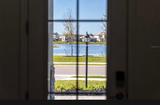 Lake view from inside front browned - 15246 Serene Shores Loop