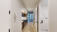 Step into a world of refined urban living at 95 Wall St. This exquisite 1-bedroom, 1-bathroom apartment is a testament to sophisticated city life, offering 460 square feet of meticulously designed space. The moment you enter, you're greeted by an air of contemporary elegance, with gleaming hardwood floors that flow seamlessly throughout.

The heart of this urban sanctuary is a stunning open-concept living area, where form meets function in perfect harmony. The kitchen, a chef's dream, boasts sleek cabinetry and top-of-the-line stainless steel appliances, inviting you to explore your culinary passions or entertain with ease.

The bedroom is a spacious retreat, offering a generous 260 square feet of tranquility. Ample closet space ensures organization is effortless, while large sliding doors add a touch of modern flair. Natural light pours in, creating an airy and inviting atmosphere that's perfect for both rest and rejuvenation.

The bathroom is a spa-like oasis, featuring luxurious marble-inspired tiles, a floating vanity, and a statement round mirror with LED lighting. This attention to detail elevates your daily routine to a pampering experience.

Every inch of this home has been thoughtfully curated to maximize both style and functionality. With its prime location and impeccable design, this apartment isn't just a place to live – it's a lifestyle upgrade, offering the perfect blend of comfort and sophistication for the discerning New Yorker.