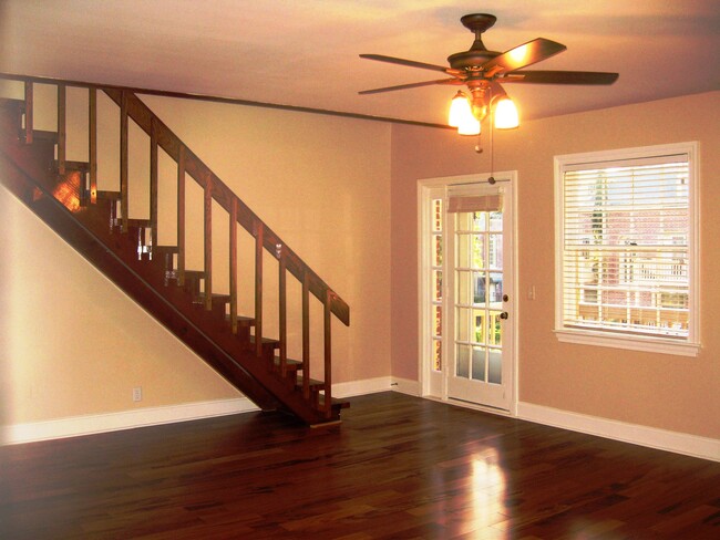 Living room with the door to the patio and stairs to the loft /master bedroom - 849 Lasalle St